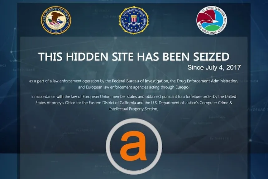 AlphaBay seizure splash reading 'This hidden site has been seized,' with US Department of Justice, FBI, and DEA seals above the orange AlphaBay logo