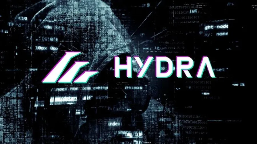 Hydra Market artwork: a hooded figure behind cascading code, with the blue HYDRA wordmark and mark
